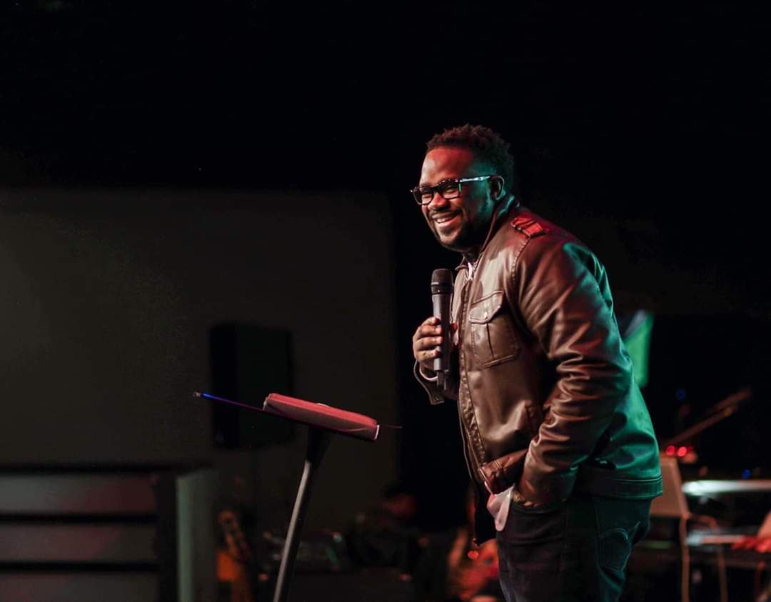 Kevin D. Money speaking on stage