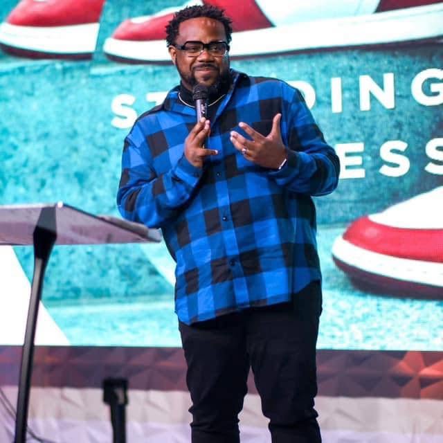 Kevin D. Money speaking from the stage